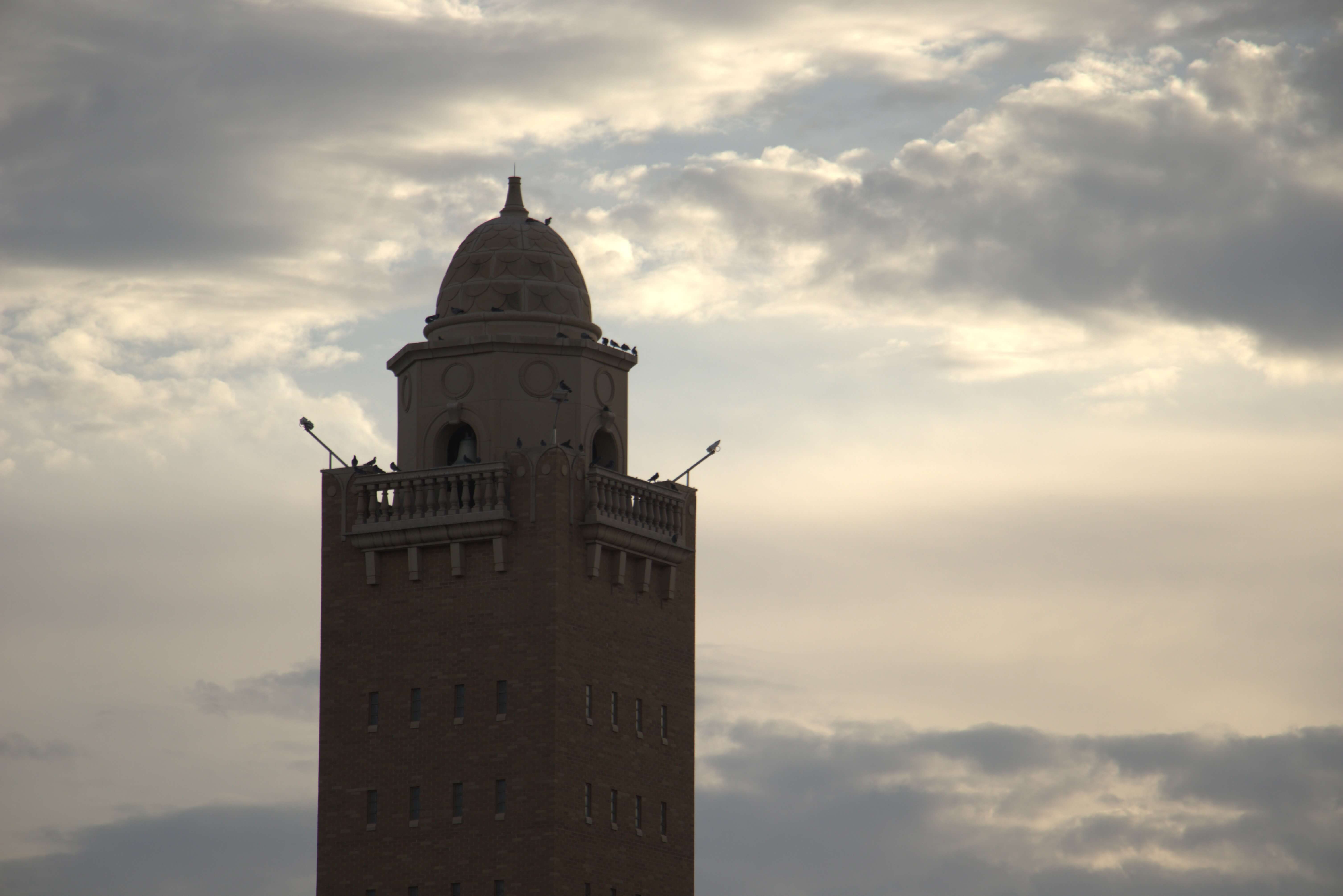 A tower on Texas Tech campus with a dramatic sky behind it
